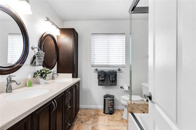 bathroom featuring oversized vanity, tile floors, dual sinks, and toilet