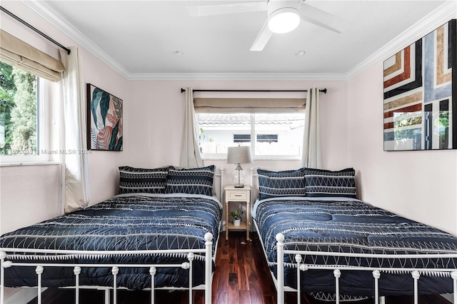 bedroom featuring crown molding, ceiling fan, and dark hardwood / wood-style flooring