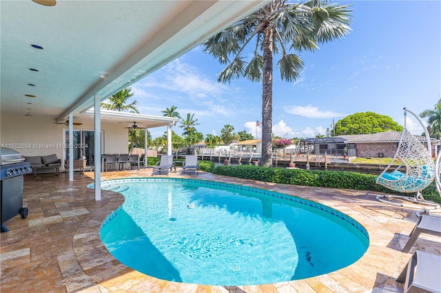 view of pool featuring a patio