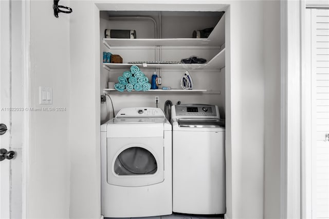 washroom with washer hookup and washer and clothes dryer