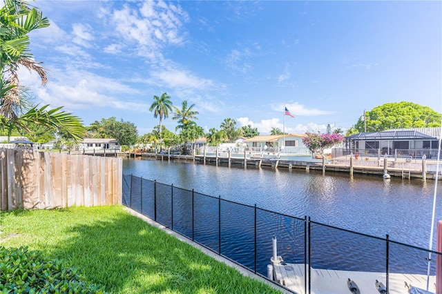 exterior space with a dock and a water view