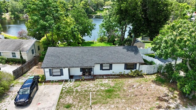 view of front of house with a water view