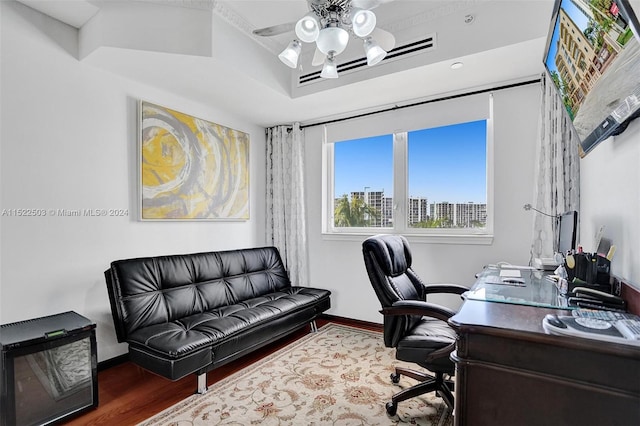 office area featuring dark hardwood / wood-style flooring and ceiling fan