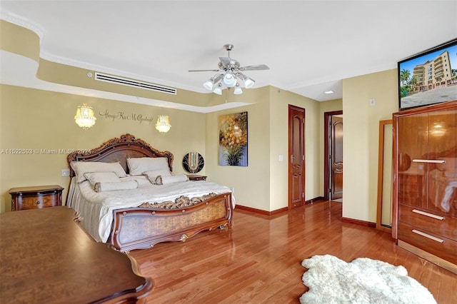 bedroom featuring hardwood / wood-style floors and ceiling fan