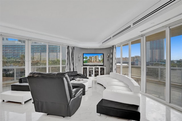 tiled living room featuring a raised ceiling