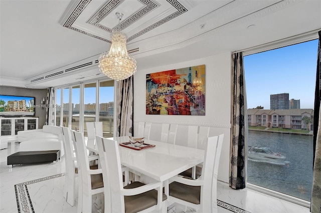 tiled dining space with an inviting chandelier, crown molding, and a water view