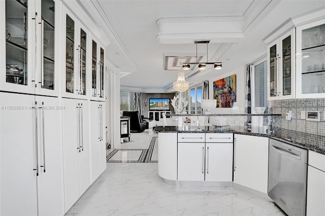 kitchen featuring hanging light fixtures, white cabinetry, backsplash, dark stone countertops, and stainless steel dishwasher