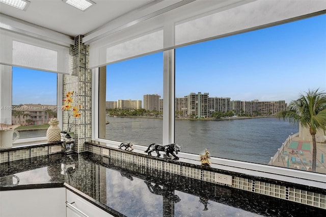 sunroom with a water view