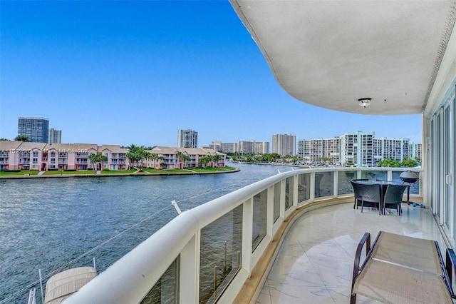 balcony featuring a water view