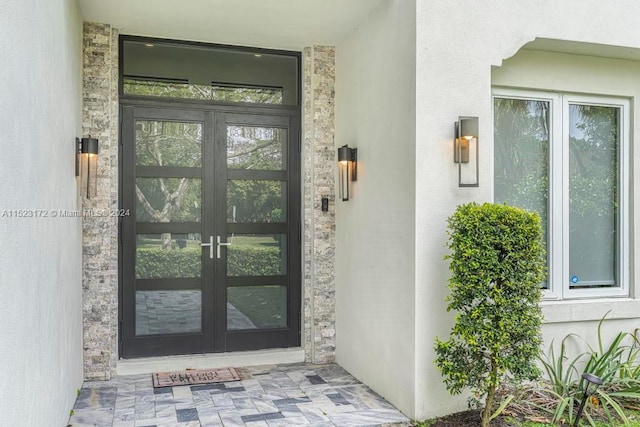 property entrance featuring french doors