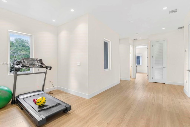 exercise area with light wood-type flooring