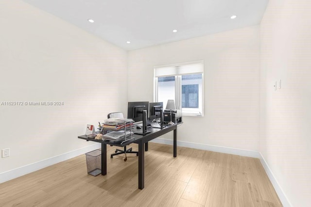 office space with light hardwood / wood-style flooring