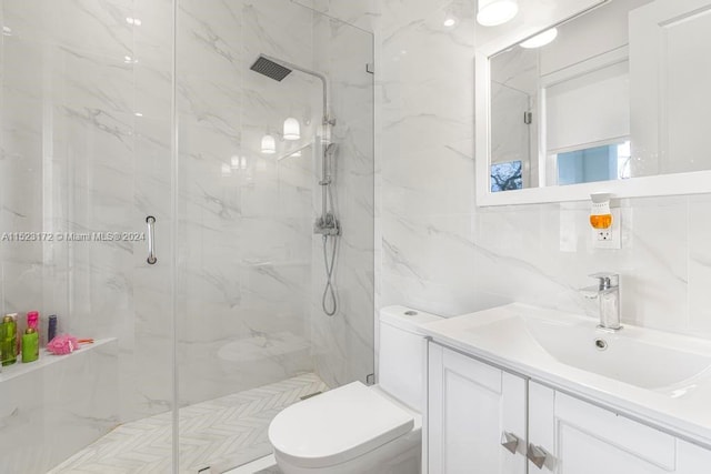 bathroom with walk in shower, oversized vanity, toilet, and tile walls