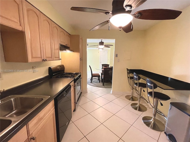 kitchen featuring ceiling fan, light tile floors, stove, dishwasher, and light brown cabinets