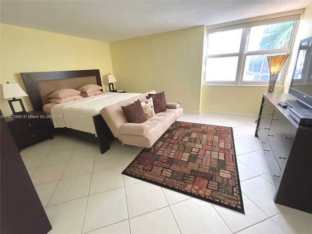 bedroom with light tile flooring