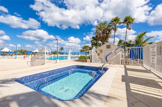 view of swimming pool featuring a patio area