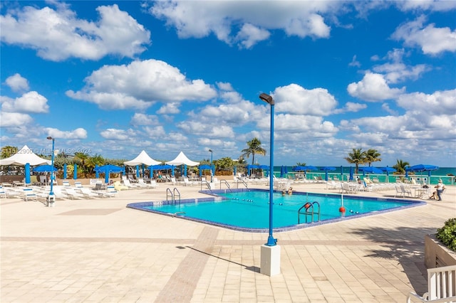 view of pool featuring a patio