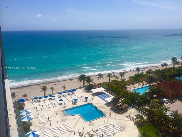 birds eye view of property featuring a view of the beach and a water view