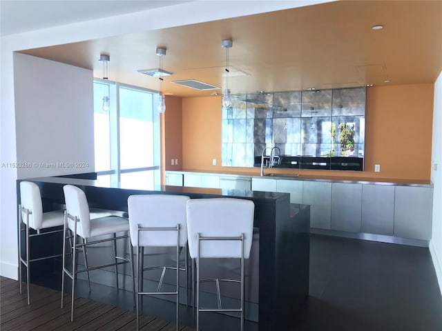 kitchen with a kitchen breakfast bar and sink