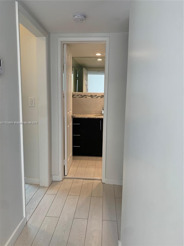 hallway featuring light wood-type flooring