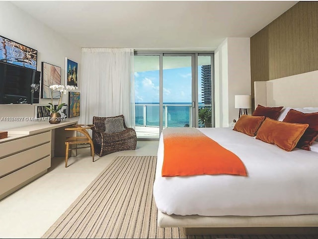 carpeted bedroom with a water view