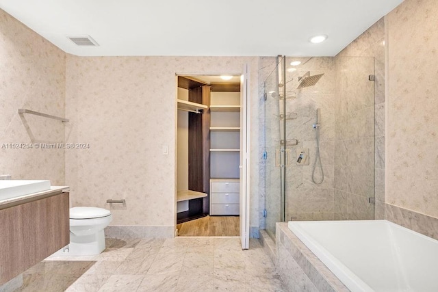 full bathroom featuring vanity, plus walk in shower, tile floors, and toilet