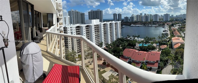 balcony featuring a water view