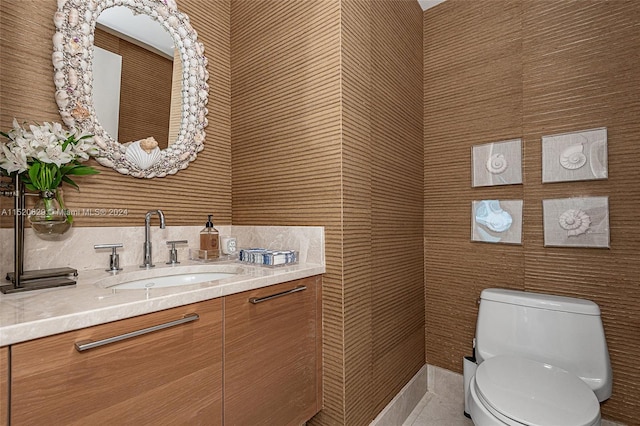 bathroom featuring toilet and vanity