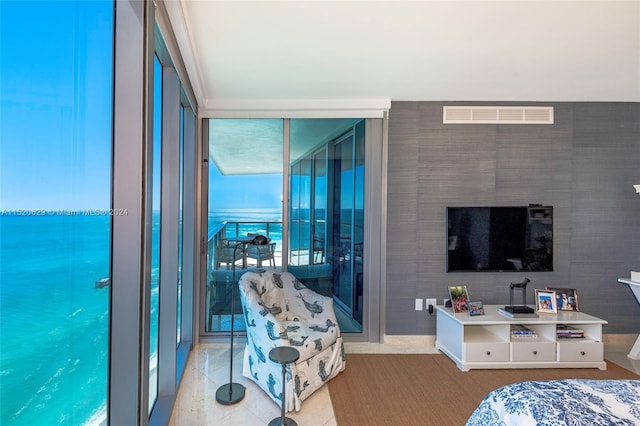 tiled living room with expansive windows