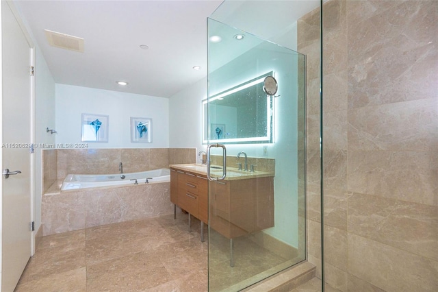 bathroom featuring shower with separate bathtub, tile flooring, and vanity