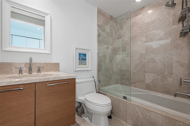 bathroom featuring vanity, tile floors, and toilet