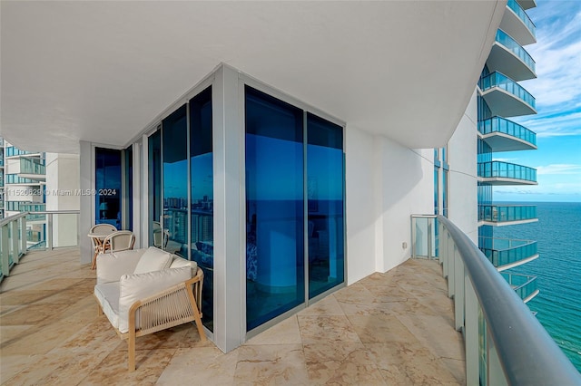 balcony featuring a water view