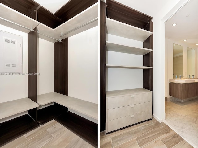 spacious closet with light tile floors and sink