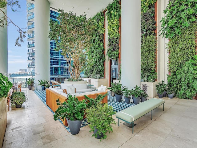 view of patio / terrace with a balcony and an outdoor hangout area