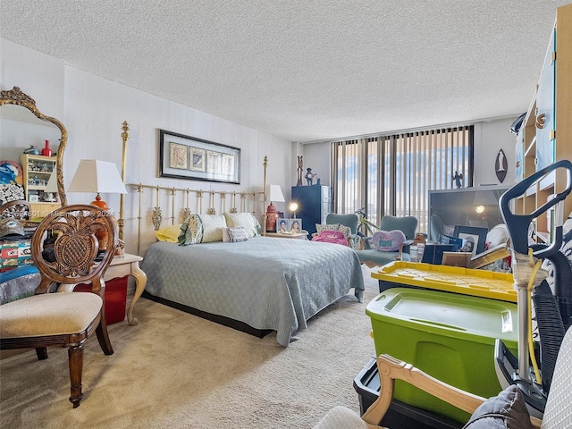 carpeted bedroom featuring a textured ceiling