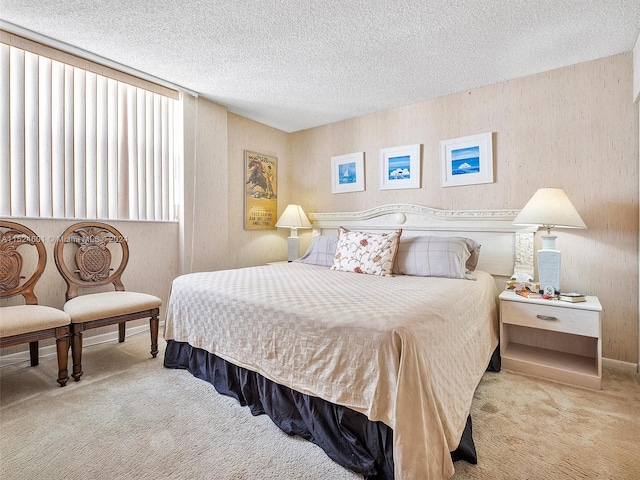 carpeted bedroom featuring a textured ceiling