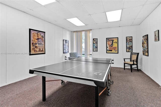 playroom featuring a paneled ceiling, billiards, and wooden walls