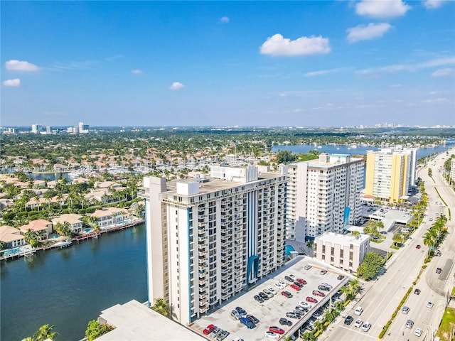 birds eye view of property featuring a view of city and a water view