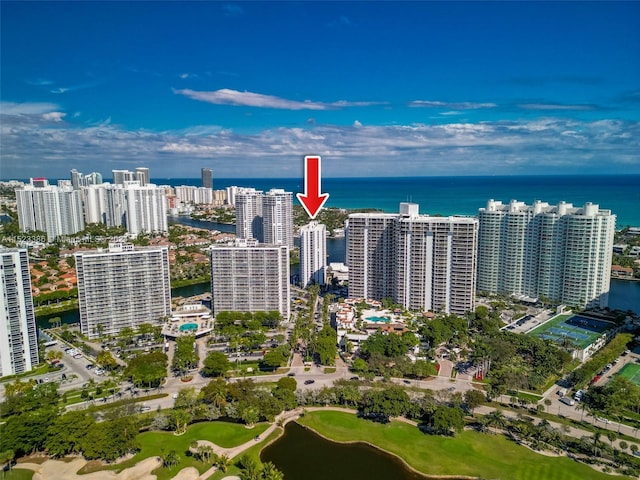 birds eye view of property with a water view