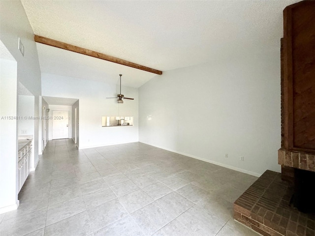 unfurnished living room featuring light tile floors, ceiling fan, and vaulted ceiling with beams