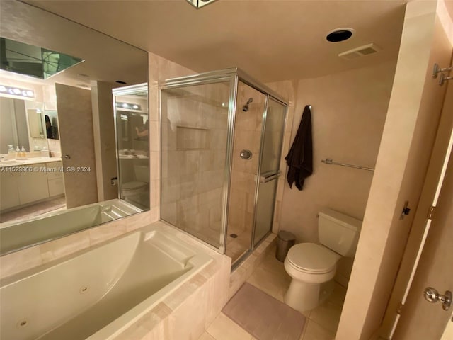 full bathroom featuring shower with separate bathtub, tile floors, large vanity, and toilet