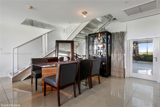 dining space with light tile patterned floors