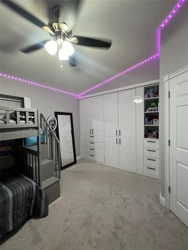 carpeted bedroom with ceiling fan