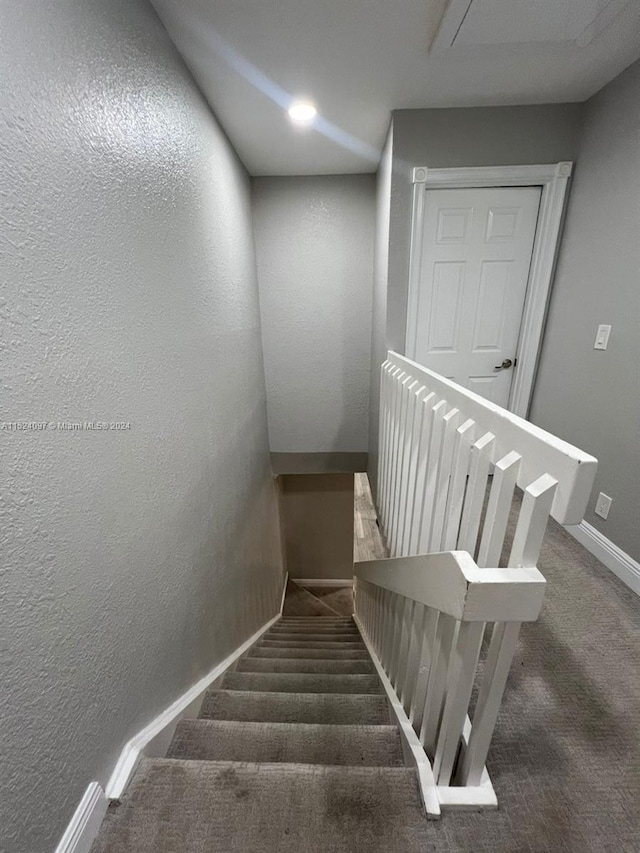 stairway with dark carpet