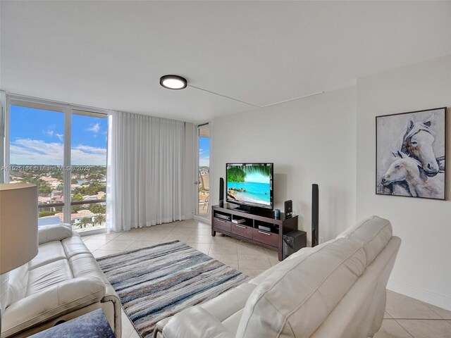 living room featuring light tile patterned floors and floor to ceiling windows