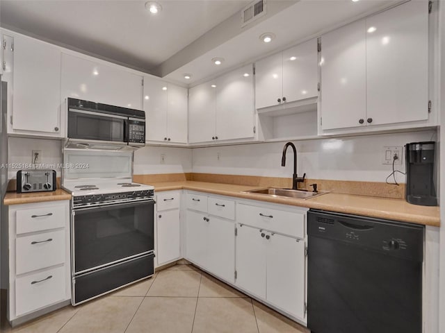 kitchen featuring white cabinets, sink, light tile patterned flooring, and black appliances