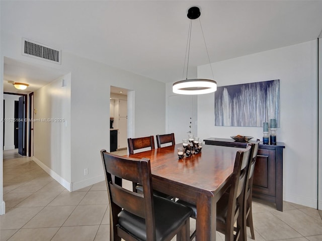 dining room with visible vents, baseboards, and light tile patterned floors