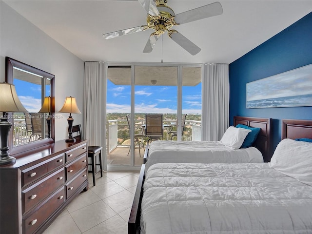 tiled bedroom featuring ceiling fan and access to exterior