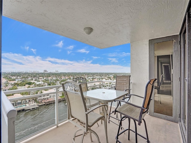 balcony featuring a water view