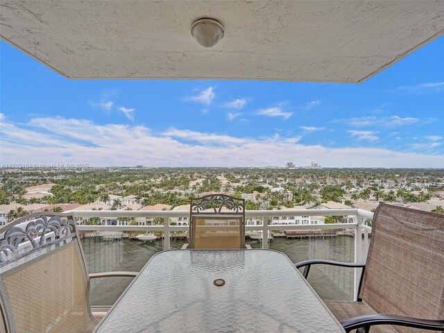 balcony featuring a water view